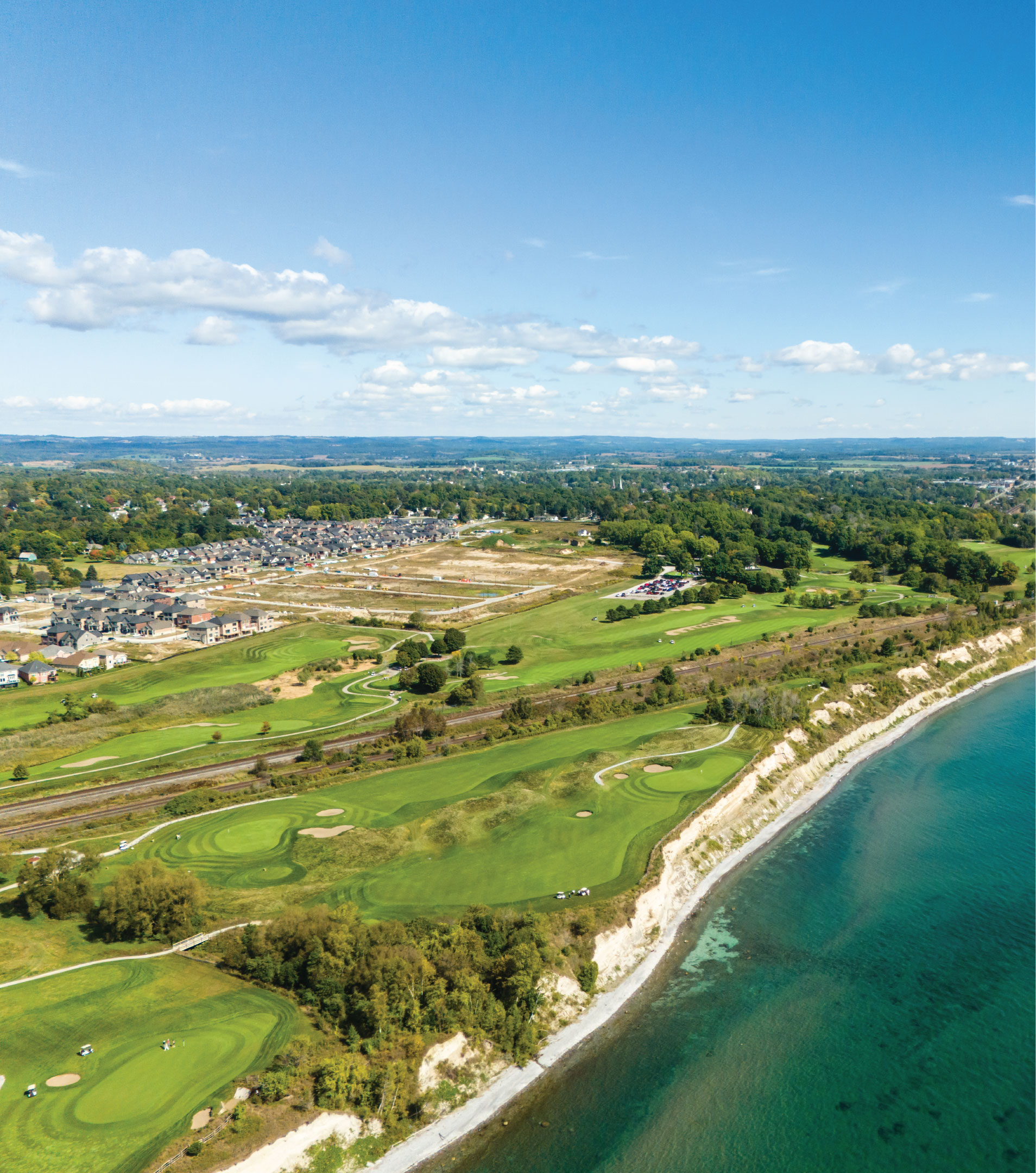 Scenic view of the lake and golf course in Port Hope, with Lakeside Village homes in the background.